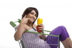 women pointing to the vegetables