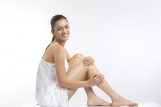 girl posing wearing a silver coloured nightdress