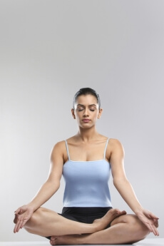 girl meditating with eyes closed