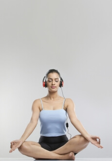 girl meditating with headphones on