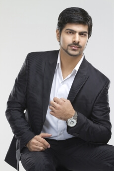 elegant gentleman posing in a suit and expensive watch