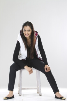joyful pretty female sitting on a stool