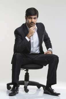 smart male executive posing in suit