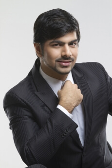 young business professional smiling while posing 