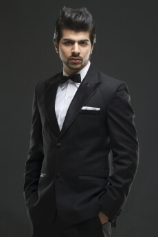 portrait of a young man wearing black suit and bow 