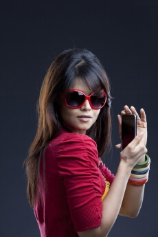 young female posing with mobile phone 