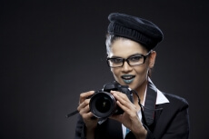 woman holding a dslr