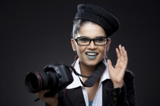 woman photographer holding camera