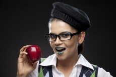young woman posing with fresh red apple