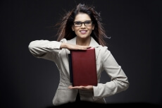 businesswoman posing with a mini laptop