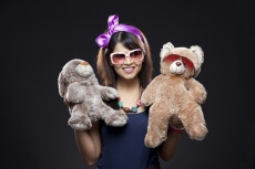 teenage girl holding her teddy bears