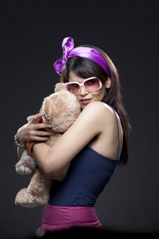 teenager hugging a teddy bear