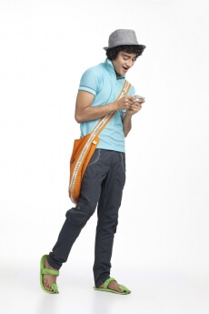young teenager texting on the cell phone