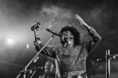 singer singing on stage at night