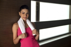 attractive young girl holding a towel around her neck