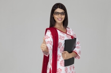 teacher showing thumps up while posing