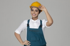 girl posing with hardhat and uniform