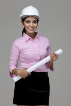 girl smiling and posing with chart paper
