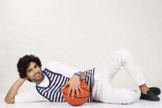 guy lying down with basketball