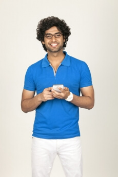 college boy texting while posing 