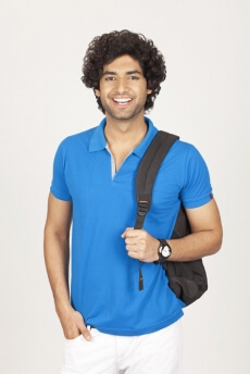 college boy smiling and posing for the camera 