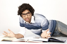 college boy with books around