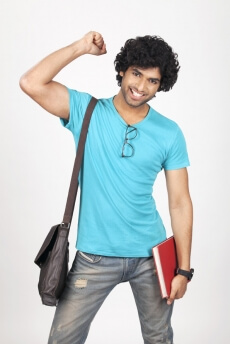 college boy carrying bag and holding a book