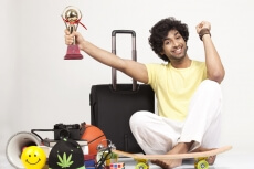 boy holding a trophy in excitement 