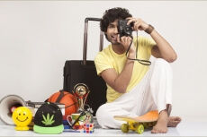 boy sitting and clicking with camera  