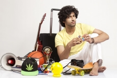 boy playing with cube while posing for the camera 