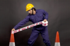 man with caution tape 