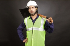 man with shovel on shoulder 