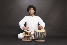 man performing classical music with tabla  
