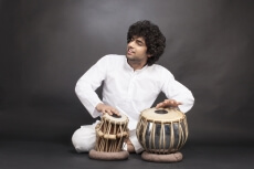 man performing with tabla