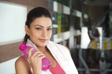 attractive girl holding a pink coloured water bottle