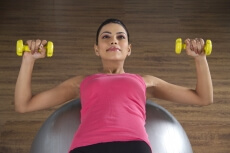 girl showing strength in her exercising routine