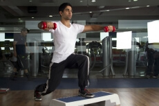 man performing aerobics at the gym