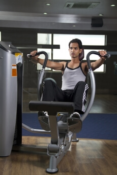 lean man working out at the gym