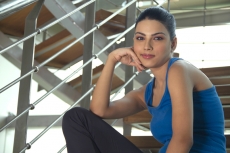 portrait of a healthy young teenager sitting in sports clothing