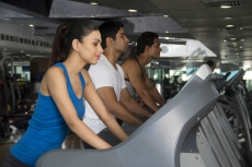 shot of three young people in the treadmill