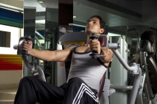 lean boy doing intense workout