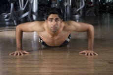 guy training hard at the gym