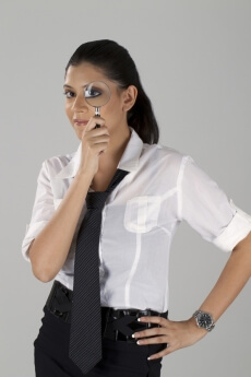 girl looking through magnifying glass