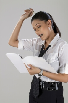business woman with file and pen in hand