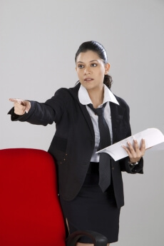 business woman pointing towards you