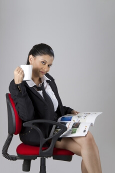 corporate woman reading a magazine