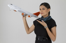 air hostess posing with an airplane toy