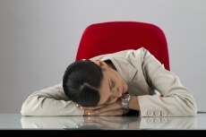 lady in the office sleeping at her desk