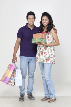 couple smiling while looking at the camera 