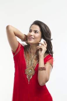 woman posing while talking on phone